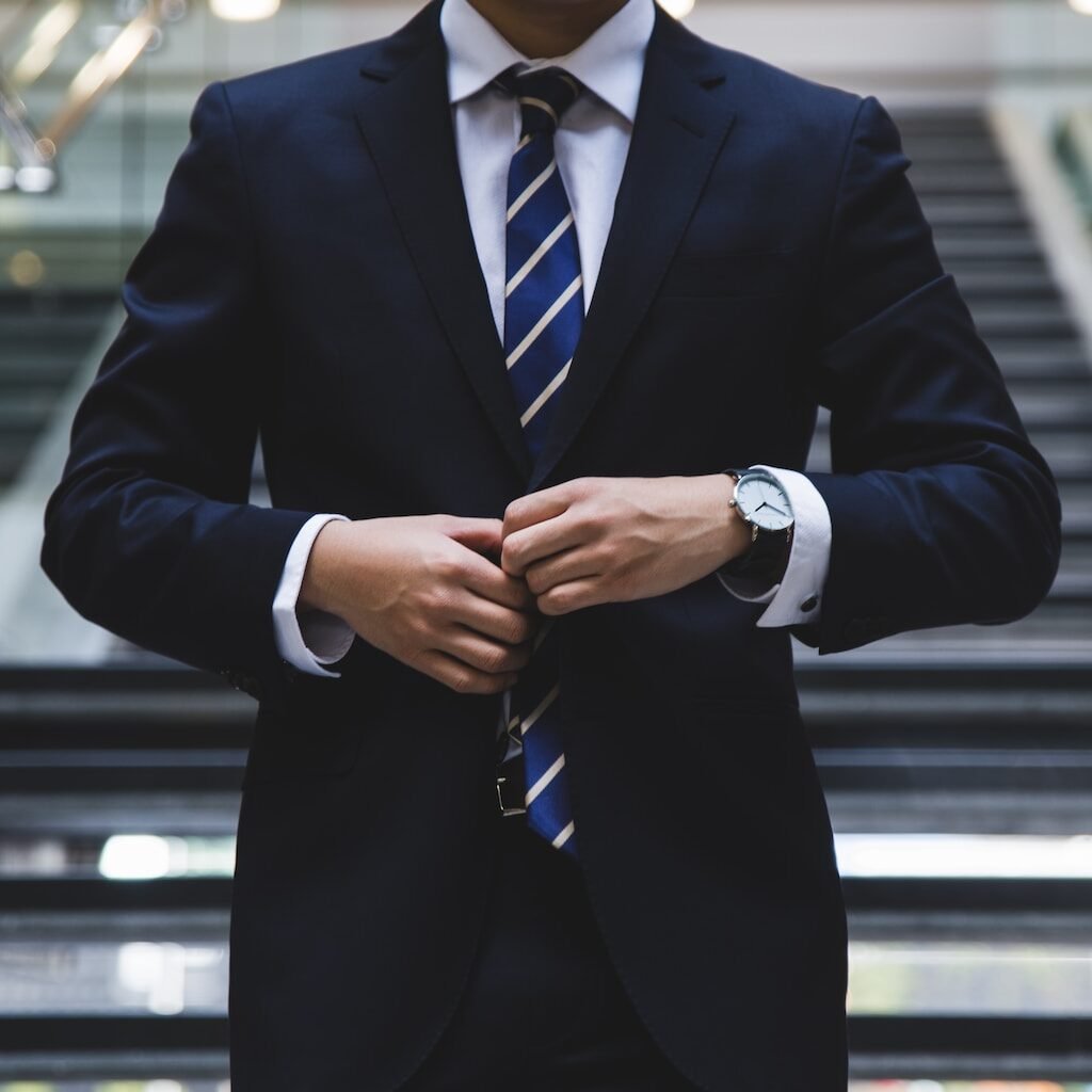 A person in a business suit, representing what a student will become after graduating with a Master in Business Administration.